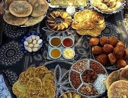 Colorful plates of Moroccan food on a table
