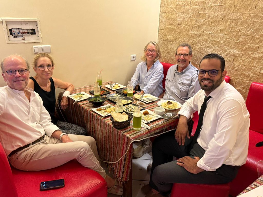 Guests and local guide together in the Moroccan desert