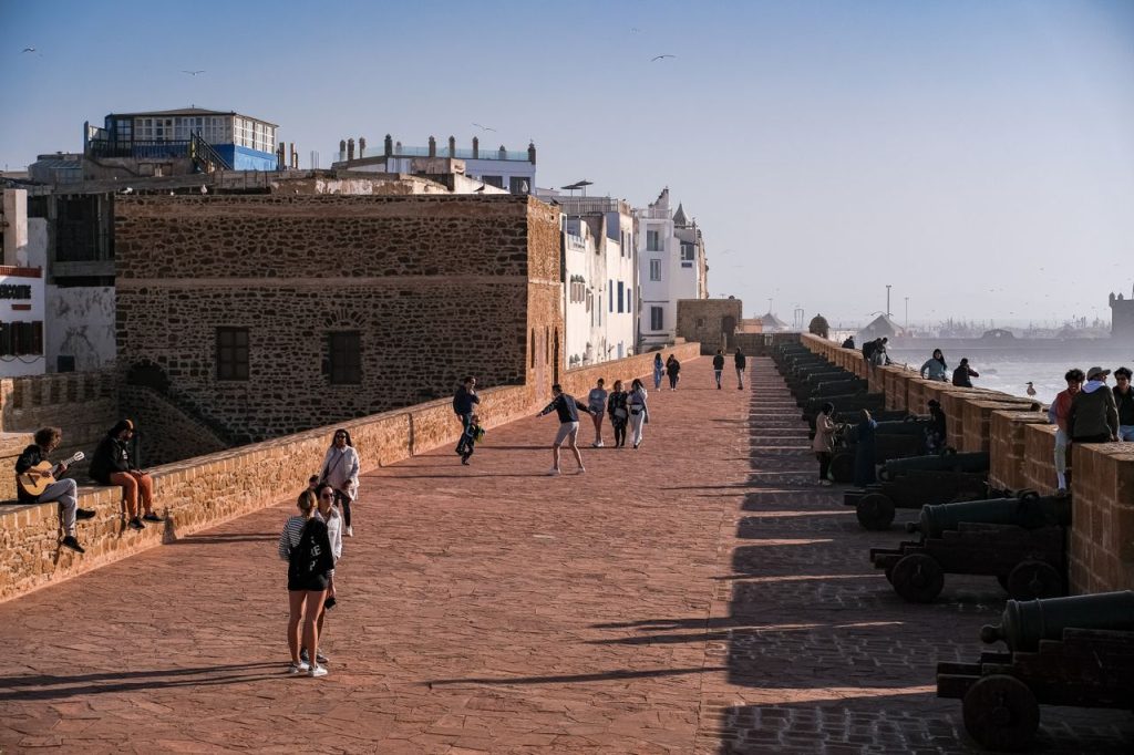 Blue-painted fishing boats and the walled medina of Essaouira